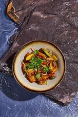 Canvas Print - Chinese-Style Sweet and Sour Chicken with Vegetables and Cilantro on Plate, Top View