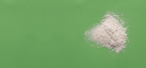 Baking soda on green background - Healthy food