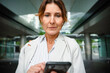 © DZ FILM/Stocksy - A woman uses a mobile phone outdoors