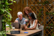© VICTOR TORRES/Stocksy - Happy diverse team collaborating using laptops and tablets at work