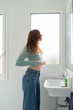 © Alba Vitta/Stocksy - woman getting dressed