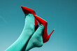 © Juan Moyano/Stocksy - man wearing socks and high-heeled shoes