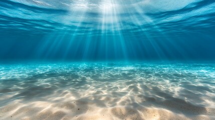 Wall Mural - underwater scene with sunlight rays penetrating through water, sandy bottom, no marine life