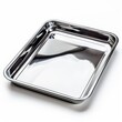 © MINMIN - Shiny, new stainless steel baking sheet isolated on white background. Perfect for baking, roasting, or serving.