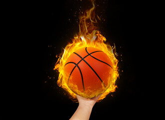 A basketball in hand with burning flames.