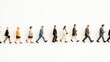 © seogi - Various business men and women miniature figures in clay texture standing in a line and walking. side view close-up. Isolated on white background.