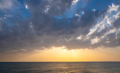 Sunset on the sea coast. Seascape orange sunset.