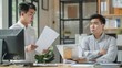 © tope007 - A Chinese employee stands in front of an office desk, showing a face of frustration and dissatisfaction, AI Generative