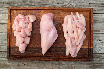 Wall Mural - Raw chicken meat fillet ( breast ) Various of cutting in form slice and cube