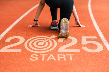 New year 2025 concept, beginning of success. Text 2025 written on asphalt road and male runner preparing for the new year. Concept of challenge or career path and change.