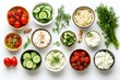 © Fariha - Assortment of fermented foods beneficial for gut health displayed in bowls on a white background Includes cucumbers tomatoes sauerkraut yogurt cottage cheese and apple cider vinegar