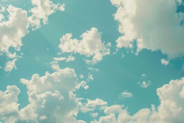 Wall Mural - a plane flying through a clear blue sky with clouds, great for travel or aviation-related images