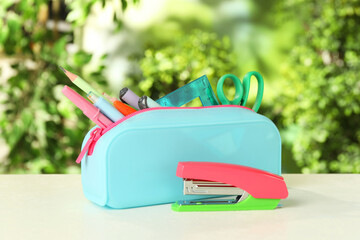 Wall Mural - Stapler, pencil case and other different stationery on white table