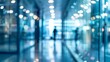 © adri - Blurred View of a Hallway with Glass Walls and People Walking