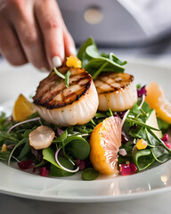 Wall Mural - A decadent seared scallop salad with arugula, grapefruit segments, avocado, and a citrus vinaigrette.