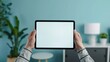 © AI Studio - Close-Up Hands Holding iPad Pro - Blue Background