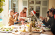 © Chanelle2000/peopleimages.com - Family, smile and laugh at Christmas lunch for festive celebration, social brunch or reunion event in backyard. Happy, people and nutrition food for party, thanksgiving tradition and house outdoor
