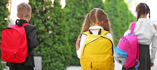 Sticker - Cute little pupils after classes outdoors