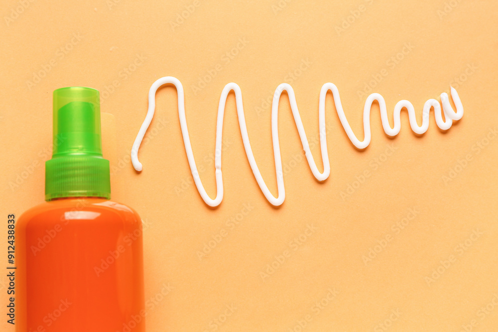 Sunscreen cream on orange background