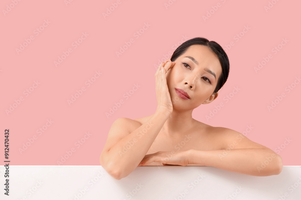 Beautiful Asian woman on pink background