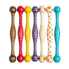 Vibrant wooden juggling clubs arranged in a neat row, showcasing various colors and patterns