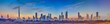 © Aquarius - Panoramic image of the illuminated skyline of Dubai at dusk after sunset