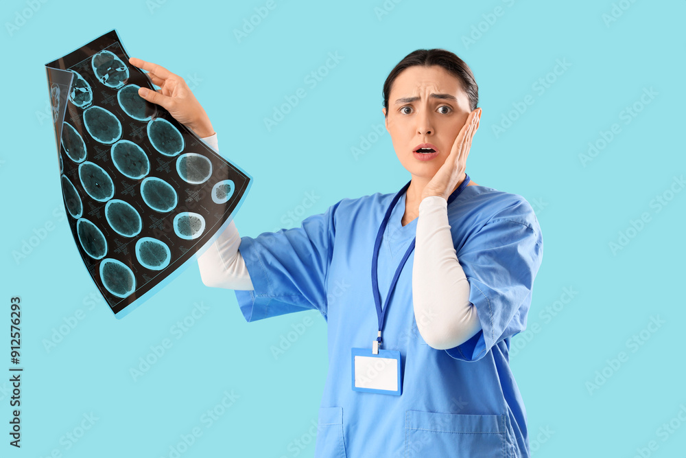 Shocked female doctor with MRI scan on blue background