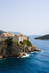 Wall Mural - view of the historic Dubrovnik city walls on rocky cliff overlooking the Adriatic Sea in Croatia