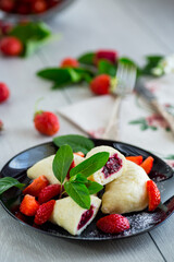 Wall Mural - cooked sweet homemade steamed dumplings with strawberries