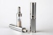 © Man888 - A sleek silver vaporizer and transparent cartridge rest side by side on a pristine white background, highlighting the device's modern design and functionality.