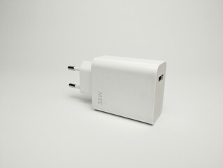 White phone charger head isolated on white background. USB charger