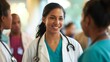 © okfoto - Confident female doctor in scrubs and a stethoscope exudes confidence and happiness while providing care in a diverse healthcare team