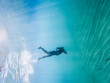 © VICTOR - A man is swimming in the ocean