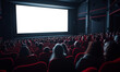 © IBEX.Media - Crowded movie theater with people seated in red chairs, facing a large white screen, capturing the cinematic experience