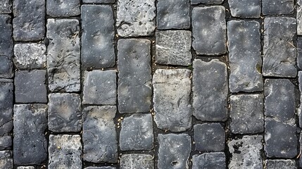 Dark gray cobblestone street pattern with green spaces