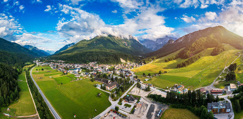 Kranjska Gora town in Slovenia at summer with beautiful nature and mountains in the background. View of mountain landscape next to Kranjska Gora in Slovenia, view from the top the town Kranjska Gora.