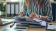 © Wattana - Office work with an employee filing documents.