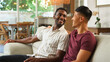 © Monkey Business - Same Sex Male Couple or Friends Enjoying a Relaxing Conversation at Home in the Afternoon