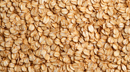 Poster - Macro shot of the texture of rolled oats highlighting the flattened light brown grains with intricate layers 