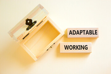 Adaptable working symbol. Concept words Adaptable working on beautiful wooden block. Beautiful white paper background. Empty wooden chest. Business Adaptable working concept. Copy space.