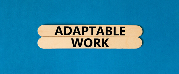 Adaptable work symbol. Concept words Adaptable work on beautiful wooden stick. Beautiful blue paper background. Business Adaptable work concept. Copy space.