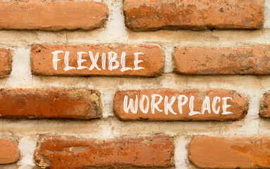 Flexible workplace symbol. Concept words Flexible workplace on beautiful brick wall. Beautiful red brown brick wall background. Business Flexible workplace concept. Copy space.