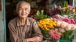 © talkative.studio - Elderly Man Selling Flowers in a Shop Entrance