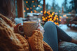 © Infinity Lens - A person sipping coffee from a mug while sitting in a cozy home setting.