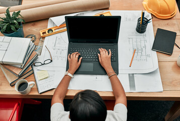 Poster - Woman, architect and typing on laptop with paperwork, above or development with design in office. Person, keyboard and blank computer screen with mockup space for review, engineering and blueprint