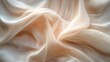 © Plaifah - Close-up of soft, elegant fabric draping and flowing gently in a serene background.