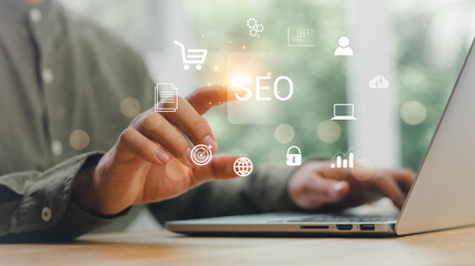 Wall Mural - businessman using a computer for analysis seo search engine optimization marketing ranking traffic w