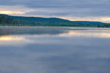 wide river and forest on the horizon