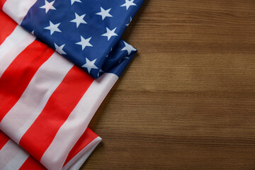 Wall Mural - Flag of USA on wooden table, top view. Space for text