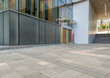 © helloabc - empty concrete ground in front of modern office buildings in downtown. floor for copy space.